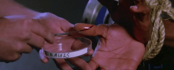 Testing for monsters in John Carpenter's The Thing.